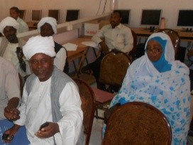 Piloting of sending and receiving SMS message with sorghum farmers during a training session at Kassala University, Kassala, Sudan. Photo: Gijs Simons