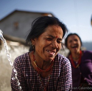 Women using a public water tap in Dhap, Nepal where the community manages the local irrigation system. Photo: Tom van Cakengerghe/IWMI