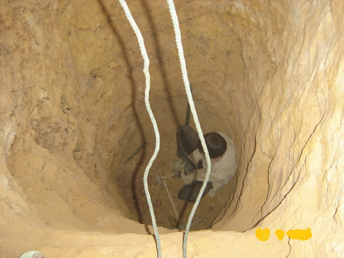 Illegal miners searching for gold at Phu Hea mining site in Pek district, Xieng Khouang province, Laos.