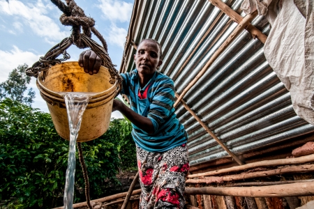 An entrepreneurial farmer employs water harvesting techniques on her plot to prevent soil erosion, as part of the Africa Rising Initiative. 